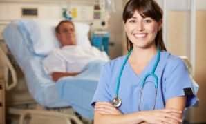 Portrait Of Nurse With Patient In Background